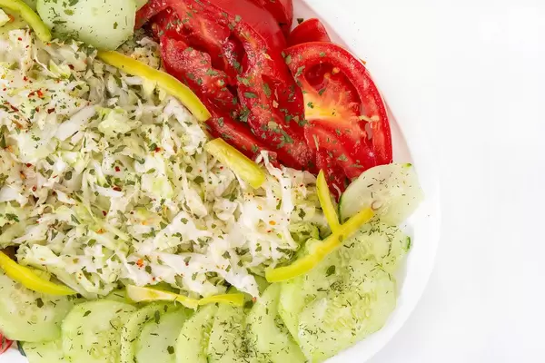 Top view of Salad with sliced Cabbage Tomato Cucumber and Paprika (Flip 2019)