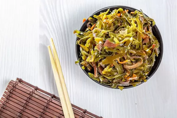 Top view of seaweed salad with chopsticks