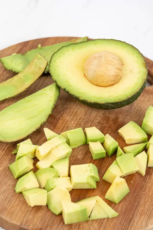 Top view of Sliced Avocado on the wooden board