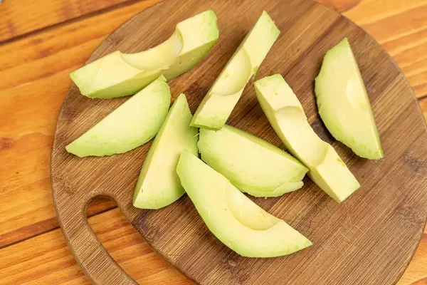 Top view of Sliced Avocado on the wooden table
