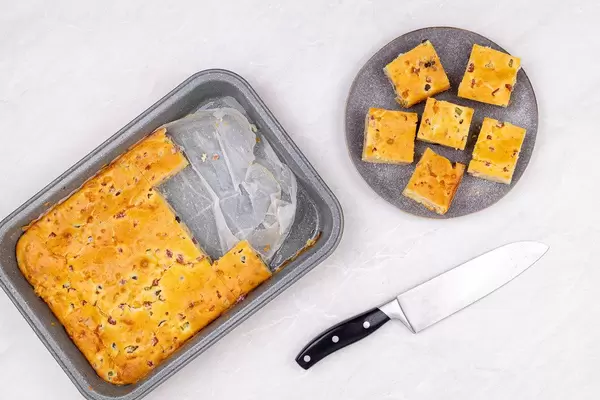 Top view of sliced baked pie with Ham Cheese and Pickles