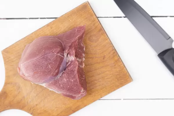 Top view of Sliced Pork Meat on the wooden board