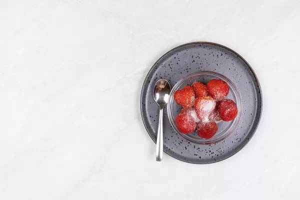 Top view of Strawberries served on the plate with copy space