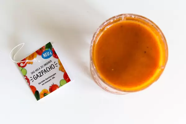 Top view of the Spanish cold vegetable soup "Gazpacho" by Innocent, filled in a glass