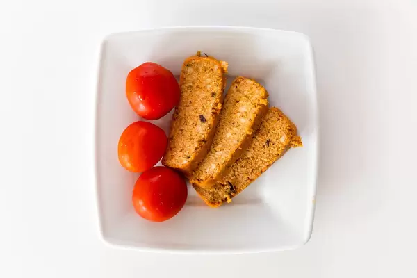Top view of three organic tofu slices "Rosso" by Taifun for a meatless diet