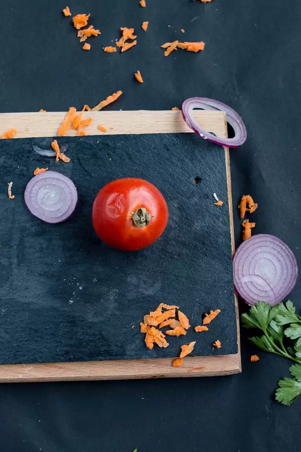 Top view of various of vegatables - a tomato, red onion, carrot