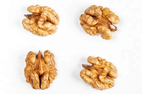 Top view of walnut kernel on a white background