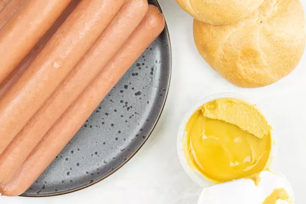 Top view of Wienerwurst with Mustard served on the table