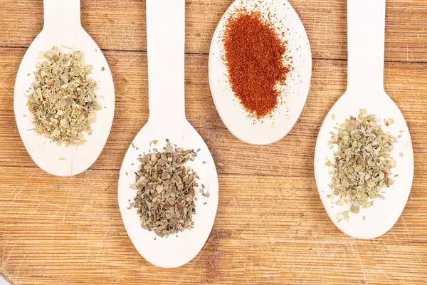 Top view of Wooden Spoons with dried spices