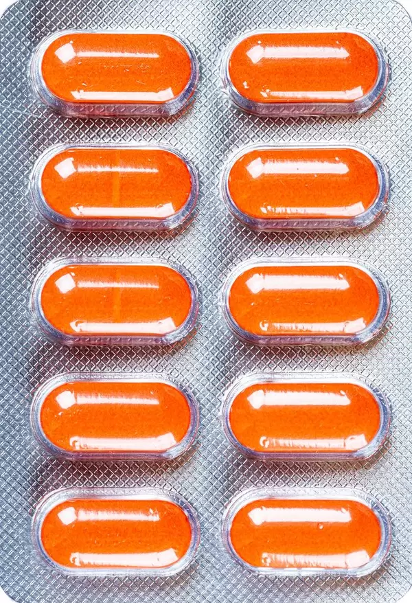 Top view, orange antibiotics in a blister