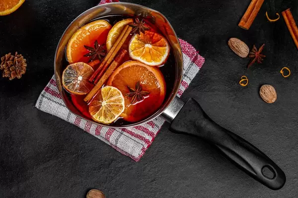 Top view pan with mulled wine and spices