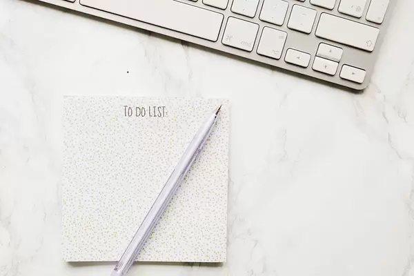 Top View Photo of a Pen on a To Do List next to a Keyboard