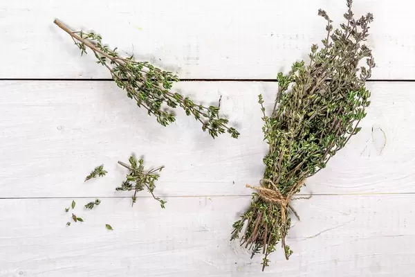 Top View Photo of Fresh Herb Thyme on a White Wooden Table