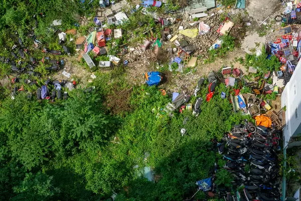Top View Photo of Motorcyle Graveyard with different Trash around it in Ho Chi Minh City, Vietnam