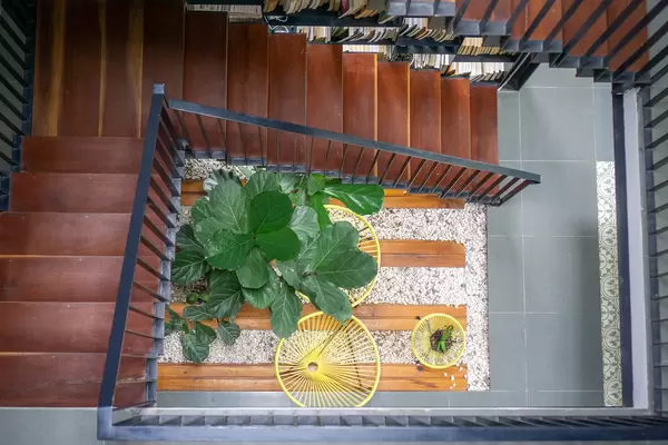 Top View Photo of Wooden Staircase with cozy Seating Area
