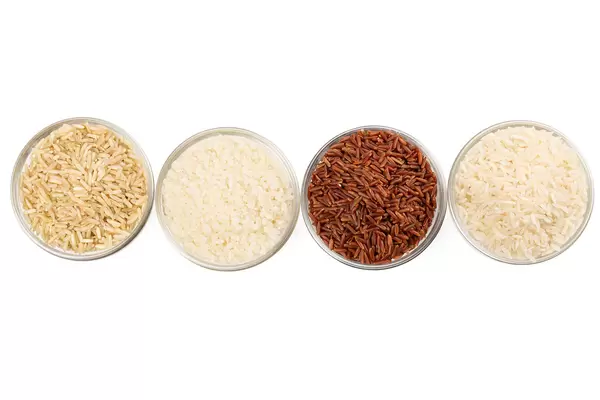 Top view, rice types - long, brown, round and unpolished