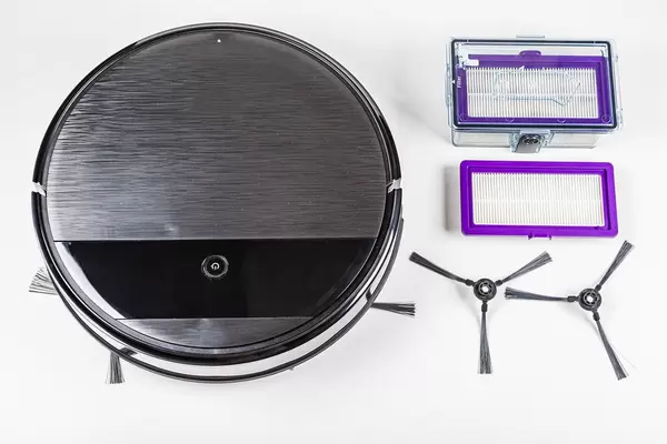Top view, robot vacuum cleaner with replaceable filters and brushes