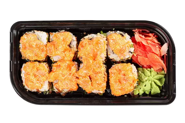 Top view, rolls with mushrooms and caviar in a black plastic container