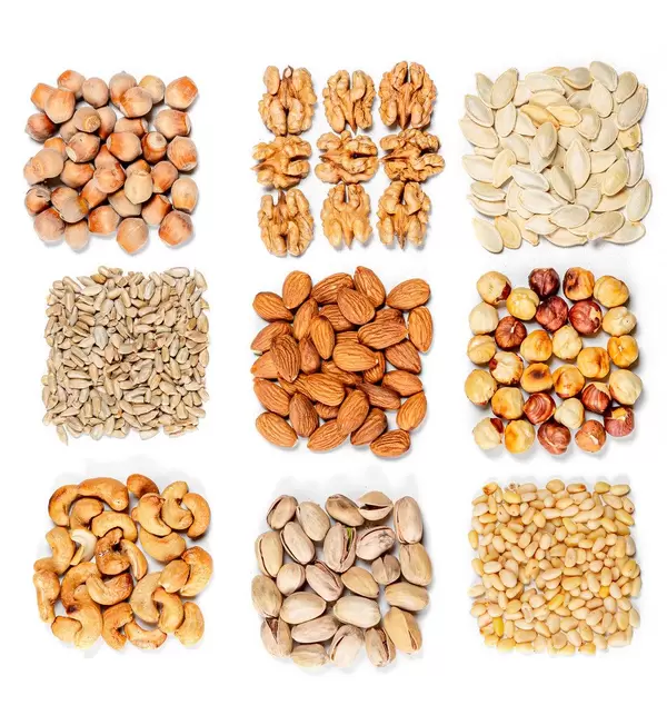 Top view, set of different types of nuts and seeds on a white background (Flip 2020)