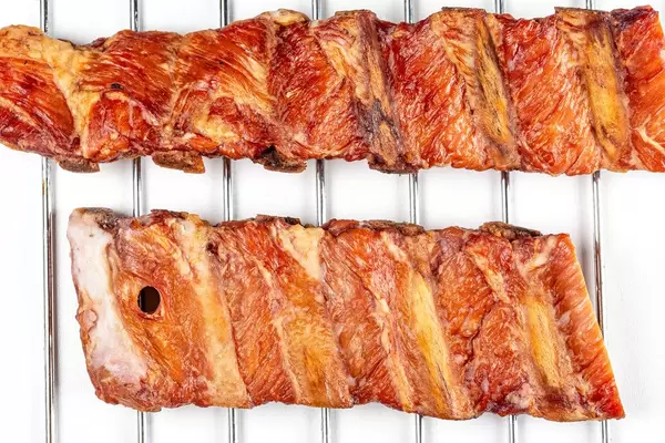 Top view, smoked ribs on a metal grille