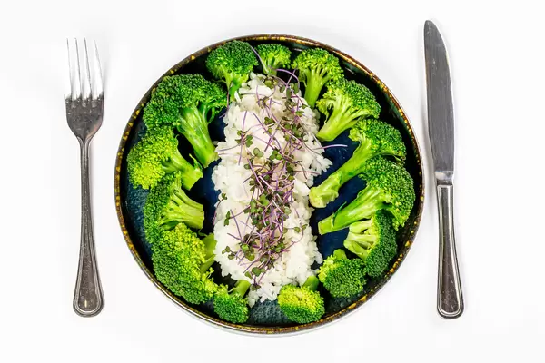 Top view, steamed rice with broccoli, healthy food concept