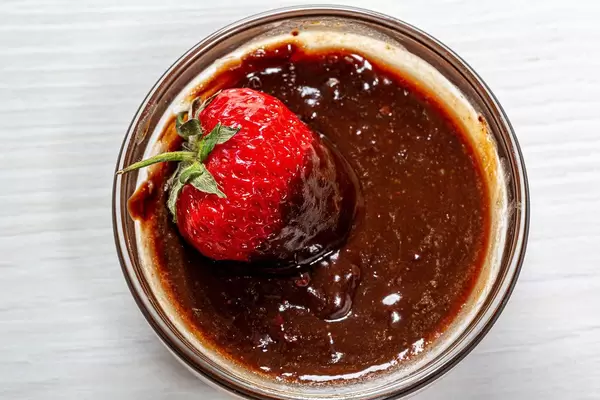 Top view strawberries in milk chocolate