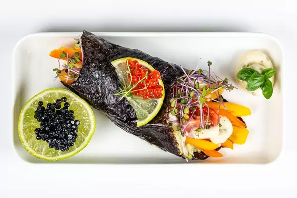 Top view, vegetable roll with red and black caviar