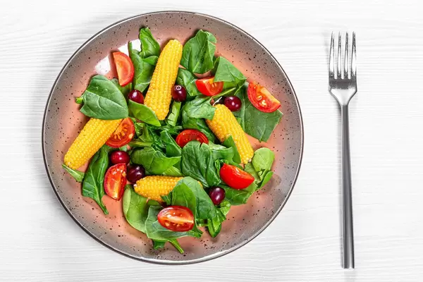 Top view vegetable salad with dogwood berries
