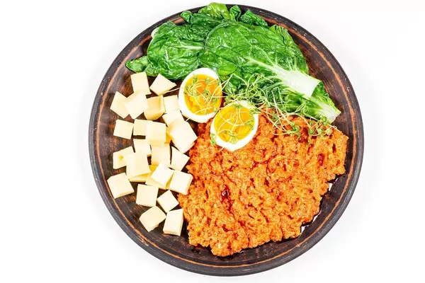 Top view, vegetables with egg and cheese on a plate (Flip 2020)