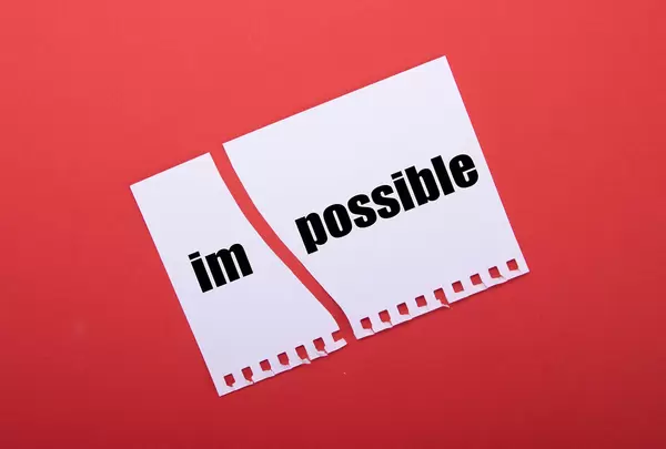 Torn paper with Impossible text on red background