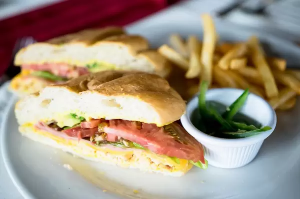 Torta Mexicana with jalapeño slices and french fries