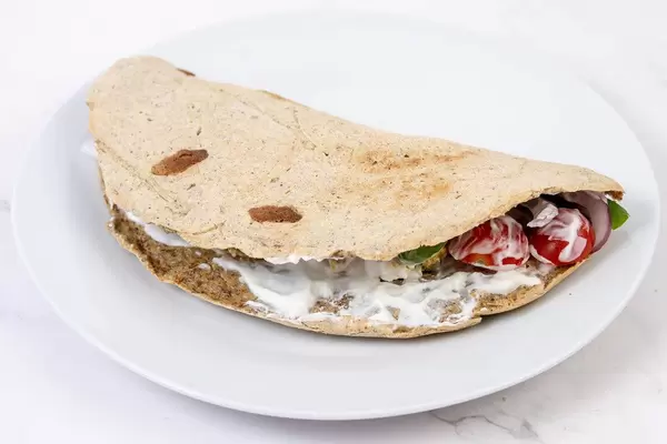 Tortilla with Chicken Meat and Vegetables on the plate (Flip 2019)