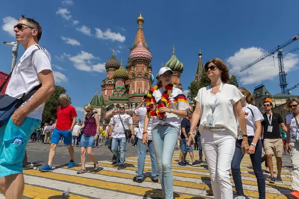 Tourists in front of the Saint Basil's Cathedral in Moscow