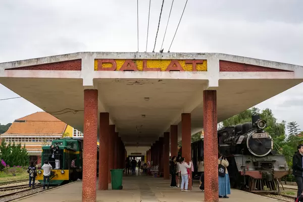 Tourists taking Pictures at the Old Dalat Railway Station with two Trains in Da Lat, Vietnam