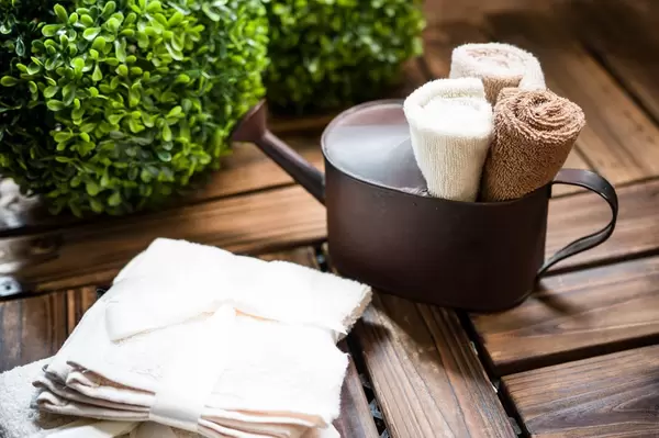 Towel rolls in watering can