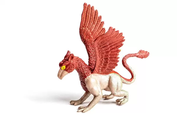 Toy griffin on a white background
