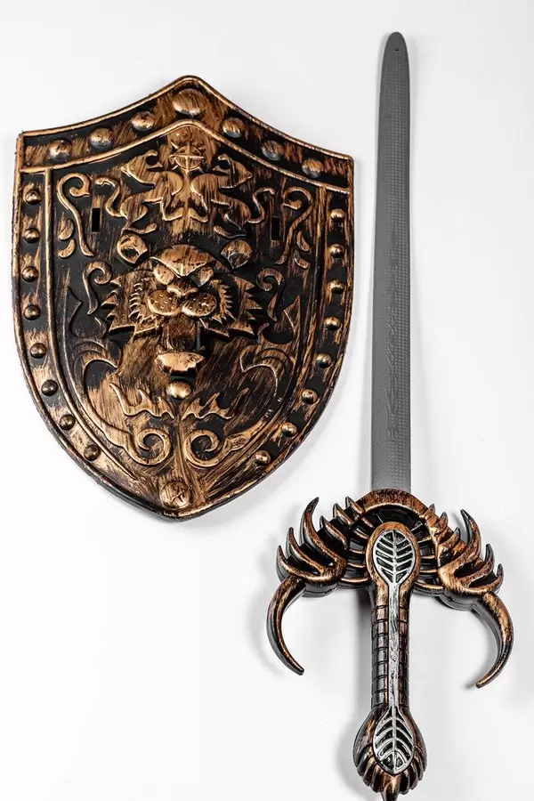 Toy shield and sword on white background