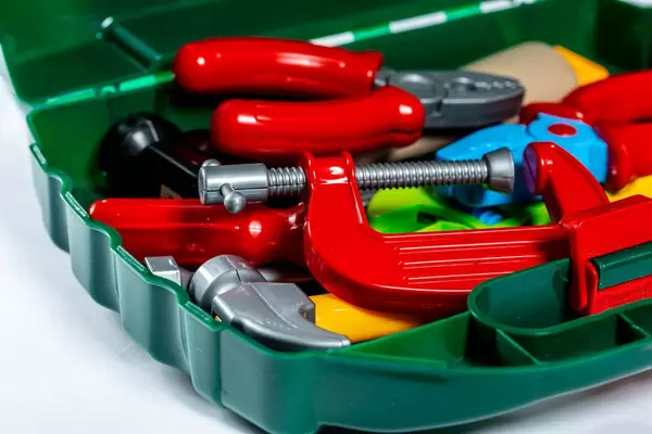 Toy tools on a light background. Children's toys