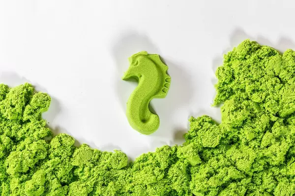 Toys for kids: green seahorse made of kinetic sand