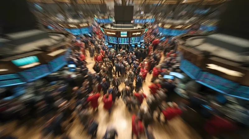 Trader auf dem Börsenparkett der NYSE (Wallstreet) von oben mit Bewegungseffekt