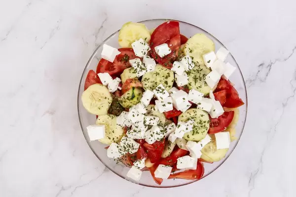 Traditional Balkan salad with Tomato Cheese Cucumber and Onions
