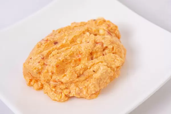 Traditional Chilli Urnebes Salad served on the white square plate (Flip 2019)