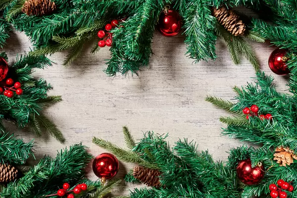 Traditional Christmas background with fir tree branches and Xmas tree decorations