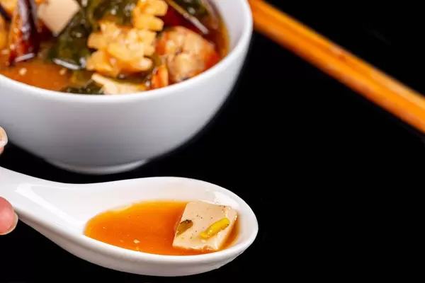 Traditional Japanese miso soup with prawns, squid, mussels and tofu