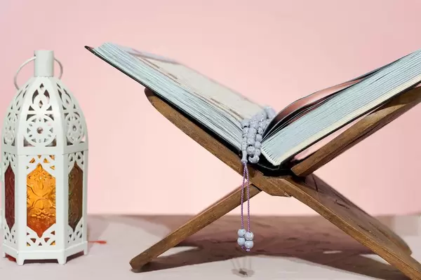 Traditional middle-eastern lantern and Islamic Holy book Koran. Islam, religion, Eid concepts.jpg