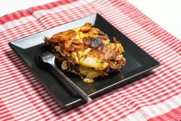 Traditional potatoes moussaka with meat served on the plate