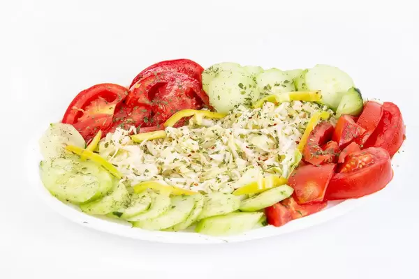 Traditional Salad with sliced Cabbage Tomato Cucumber and Paprika
