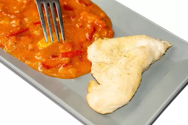 Traditional tomato stew with vegetables and chicken white meat