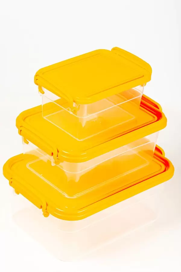 Transparent plastic food containers with orange lids