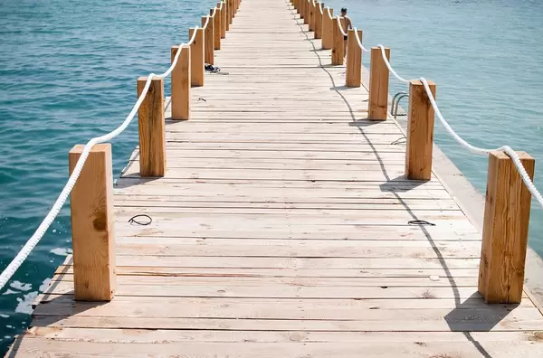Travel Photo of Wooden Footbridge to the Sea in the Summer